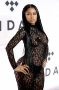 Album of Nicki Minaj wearing a completely see-through bodysuit (w/ her nipples covered by pasties)