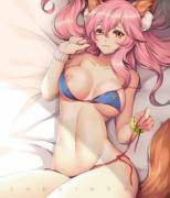 Tamamo laying in bed