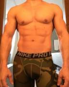 Muscle stud in camo compression shorts