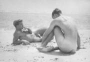 Smoking on the beach, naked (1940s)