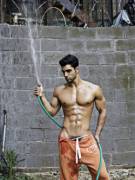Playing with his hose.