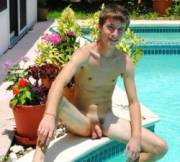 Naked boy by the pool