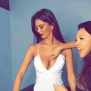 Applying lotion to and groping the model's boobs