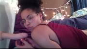 Cutie in glasses sucking on her toy