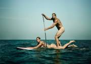 Volleyball player Gabrielle Reece being used as a surfboard