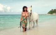 Chloe Vevrier shows off her amazing breasts while walking her horse through the water