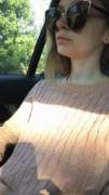 Hottie shows off pale boobs in the car
