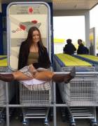 Pantyless leg spread on the shopping cart