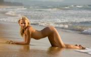 This sultry blonde seems to have a talent for finding shellfish!