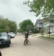 Drive-by ass shake. Big booty swerving on a bike [gif]