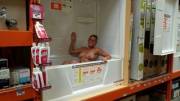 Naked in a retail store bathtub display