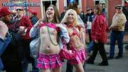 Two Mardi Gras flashers in plaid skirts
