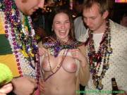 Happy girl with her tits out at Mardi Gras