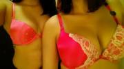 two girls trying on bombshell bras in VS dressing room