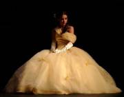 Belle. in a golden Ball Gown courtesy of Disney's Beauty and the Beast in 3d.