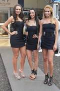 Three girls in little black tube top dresses and different heels (-post /r/PromoBabes)