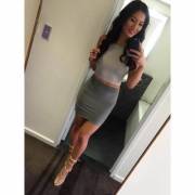 Asian in a grey skirt