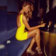 Desire Cordero in yellow mini dress