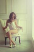 Sitting on a Chair in White Lingerie