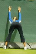 Maria Sharapova stretching before her match
