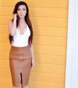 Lynn Chu in a leather skirt and bodysuit
