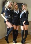 three blonde schoolgirls