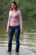 Cute girl wearing jeans and a tight wet clingy shirt