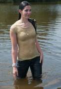 A girl in tight shirt gets wet, her bra shows clearly through her clingy clothes!