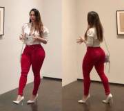 White shirt, red jeans, and a big booty...