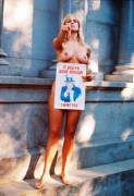Vicky Drake posing nude for her Stanford student body president campaign poster outside the Stanford Mausoleum, 1968