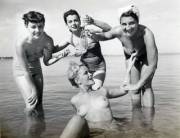 4 friends playing in the water, 1940s