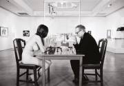 Eve Babitz and Marcel Duchamp playing chess, 1963