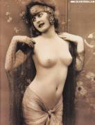 A Parisian girl poses nude for this vintage erotica postcard in the early 1900s, during the heyday of France’s Belle Epoque (“Beautiful Age”)