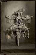 Woman in aquatic costume made of pearls, around 1920.