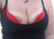 Spilling out of both bra and top!