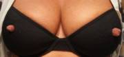 Long nipples poking through a bra