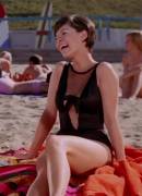 Yvonne Craig giggling and jiggling on the beach as Batgirl (Batman '66)