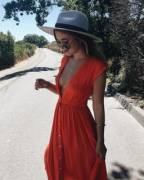 Braless in plunging summer dress