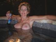 Relaxing in a hot tub with a beer