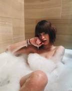 Beautiful babe in a big bubbly bath