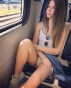 Pretty cutie showing panties on the train