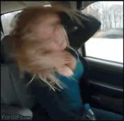 She whips her hair back and forth. [GIF]