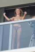 Rosie Huntington Whiteley spotted on balcony during topless photoshoot