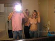 Topless in bathroom mirror