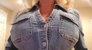Literally bursting out of her jean jacket