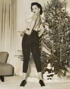Christmas Greetings from an unidentified model by Bunny Yeager (1950s)