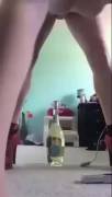 Amateur teen inserts a bottle