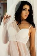 If you're looking for big curves, she's not your gal. But a lovely bridal boudoir, nonetheless (AIC)