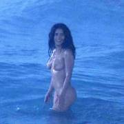 Salma Hayek swimming in the ocean.