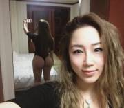 Asian chick showing off her ass...
